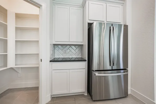 a kitchen with appliances and cabinets