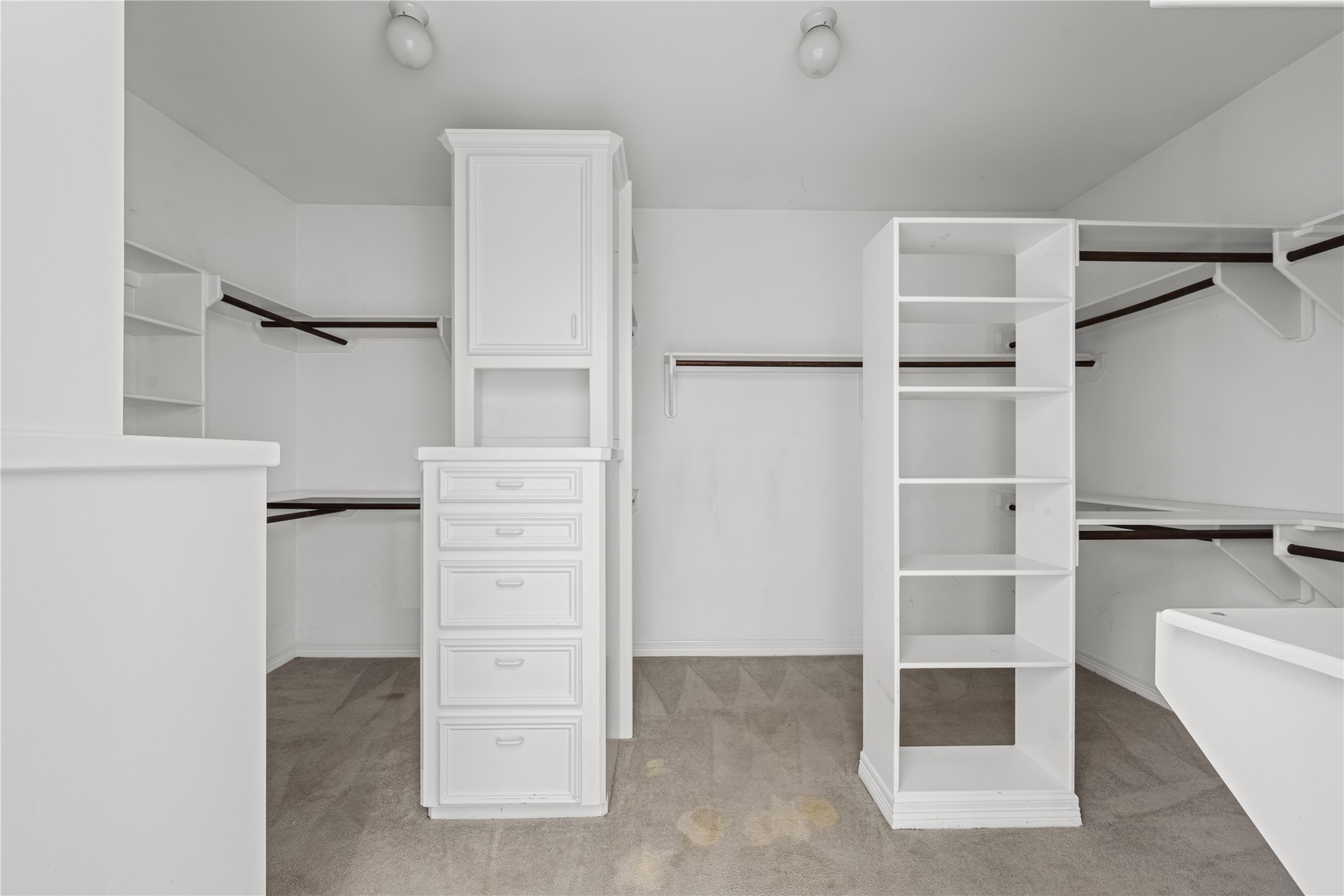 20240 Cypress Rosehill Road Tomball, TX 77377 - Photo 26 of 26 a view of walk in closet with empty racks