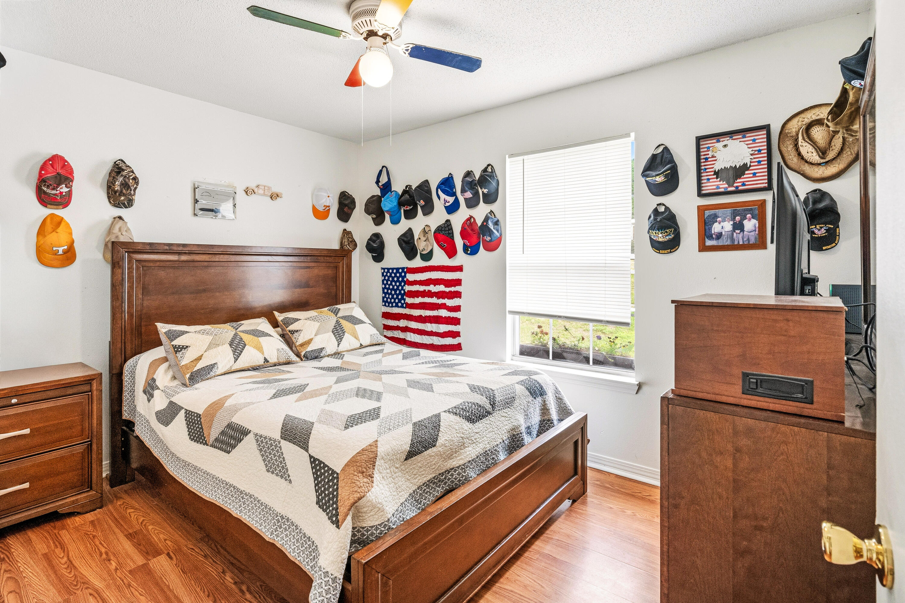 2880 Aplin Road Crestview, FL 32539 - Photo 20 of 33 a bedroom with a bed and a chandelier