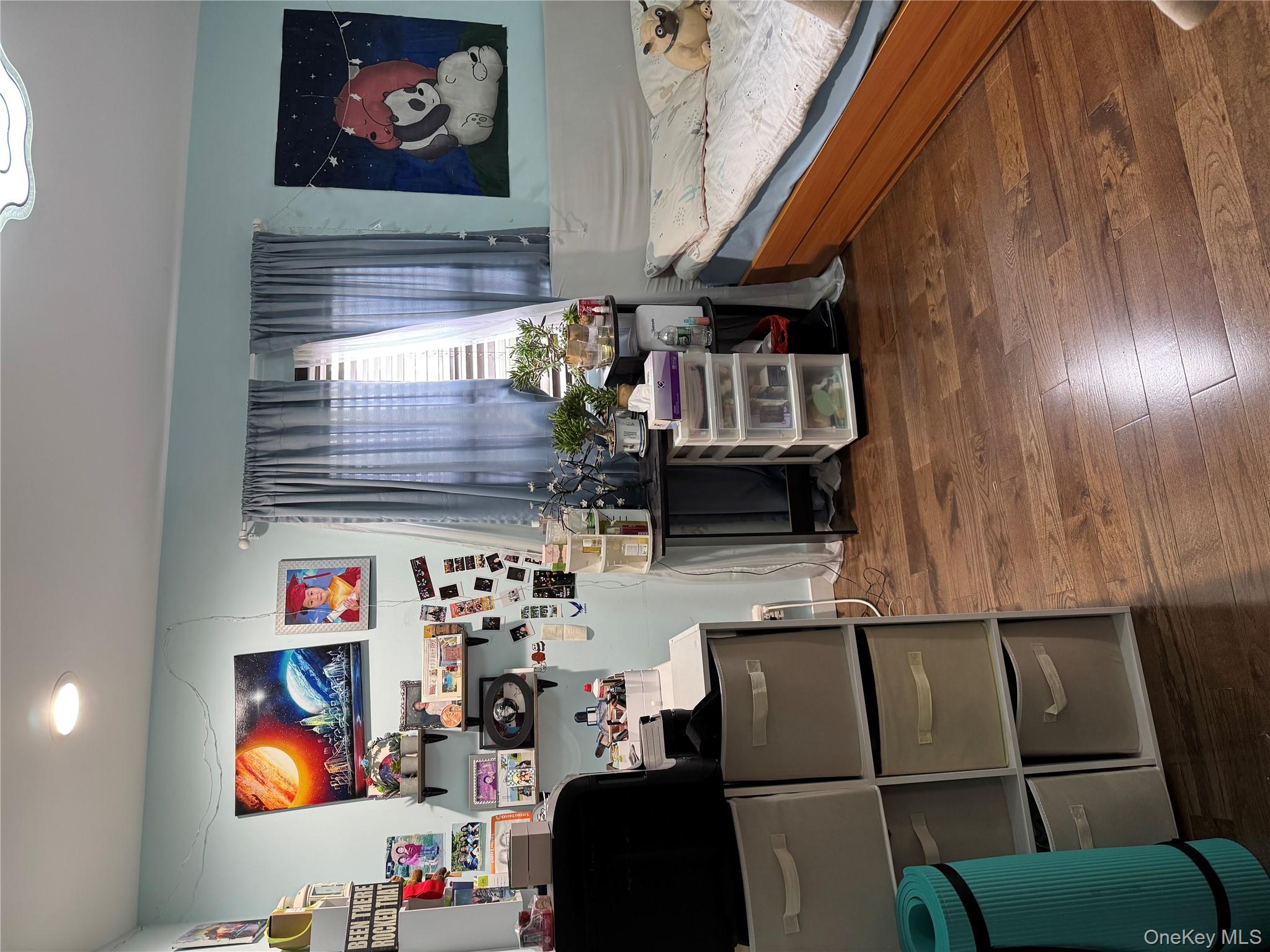 43-20 Junction Boulevard Queens, NY 11368 - Photo 3 of 6 a living room with furniture and a window