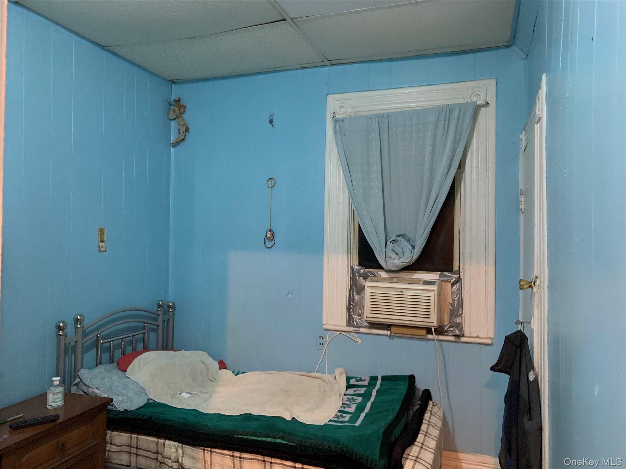 43-20 Junction Boulevard Queens, NY 11368 - Photo 4 of 6 a bathroom with a toilet a sink and mirror