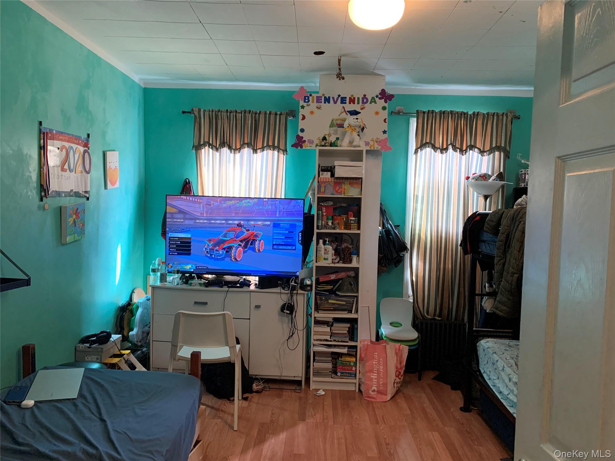 43-20 Junction Boulevard Queens, NY 11368 - Photo 5 of 6 a room with furniture and a window