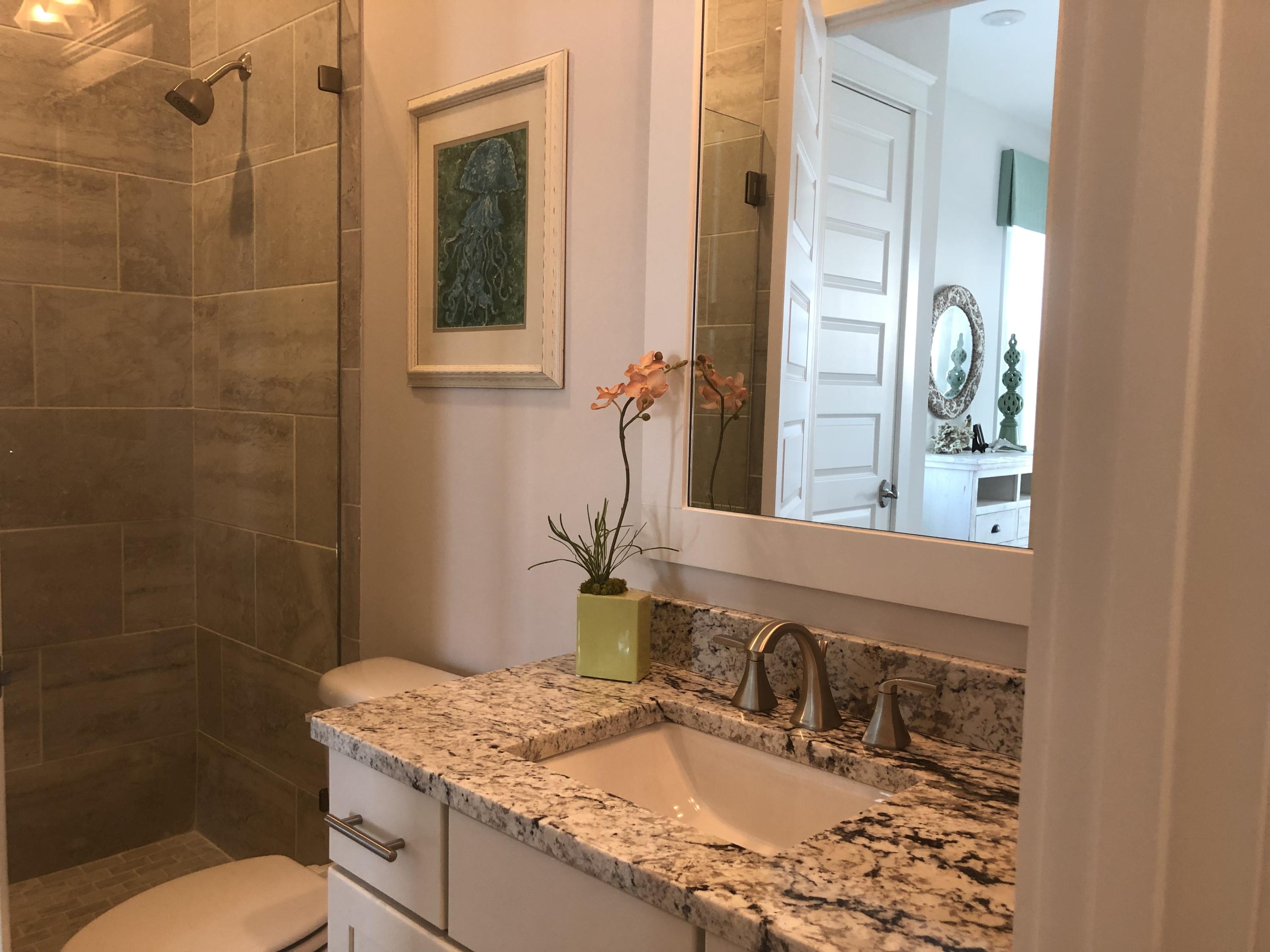 98 Siasconset Ln Inlet Beach Inlet Beach, FL 32461 - Photo 22 of 31 a bathroom with a granite countertop sink a toilet and mirror