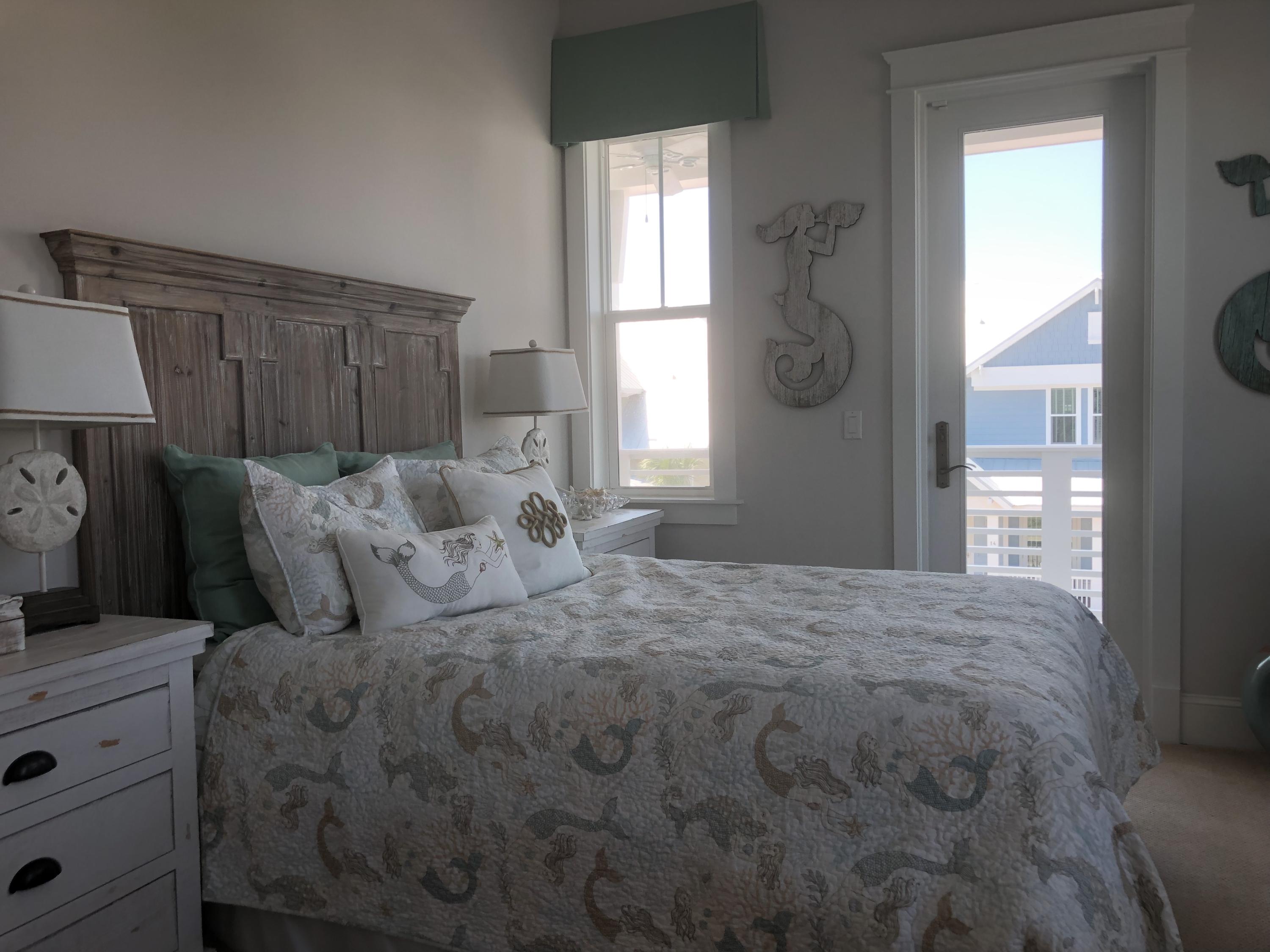 98 Siasconset Ln Inlet Beach Inlet Beach, FL 32461 - Photo 24 of 31 a large bed sitting in a bedroom next to a window