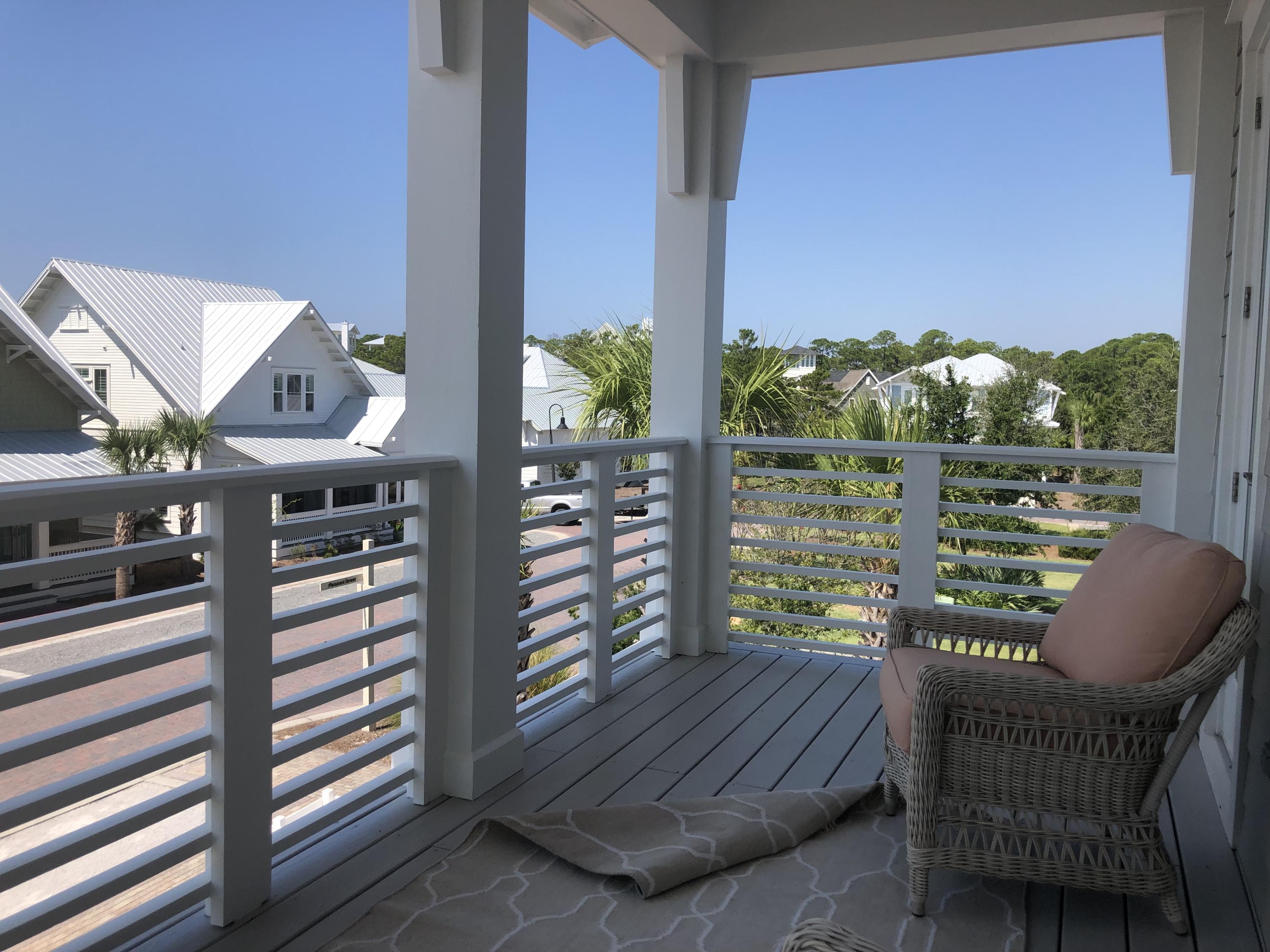 98 Siasconset Ln Inlet Beach Inlet Beach, FL 32461 - Photo 25 of 31 a view of balcony with two chairs and a potted plant