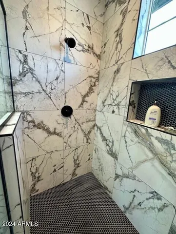 a view of a door and brick wall