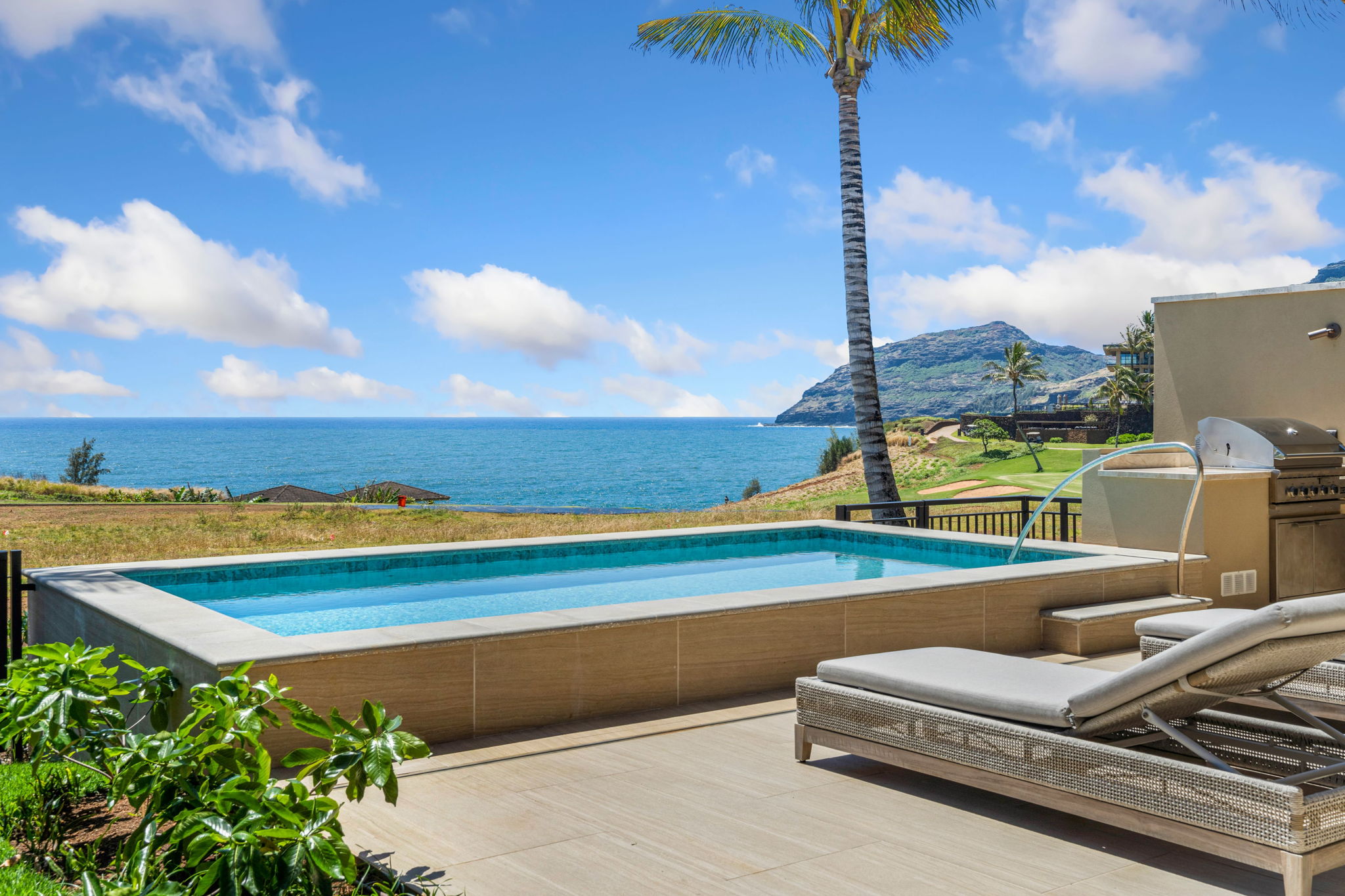 a view of a lake with couches in the patio