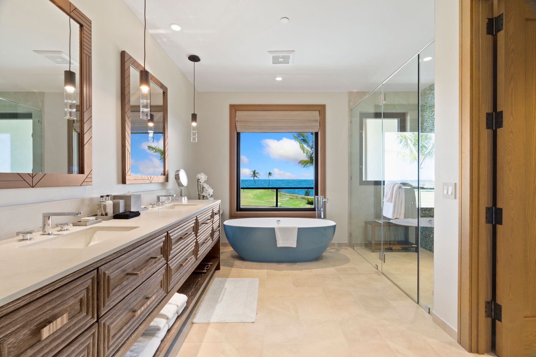 3770 Alaoli Way, Unit 3003 Lihue, HI 96766 - Photo 24 of 30 a bathroom with a double vanity sink a toilet a window and mirror