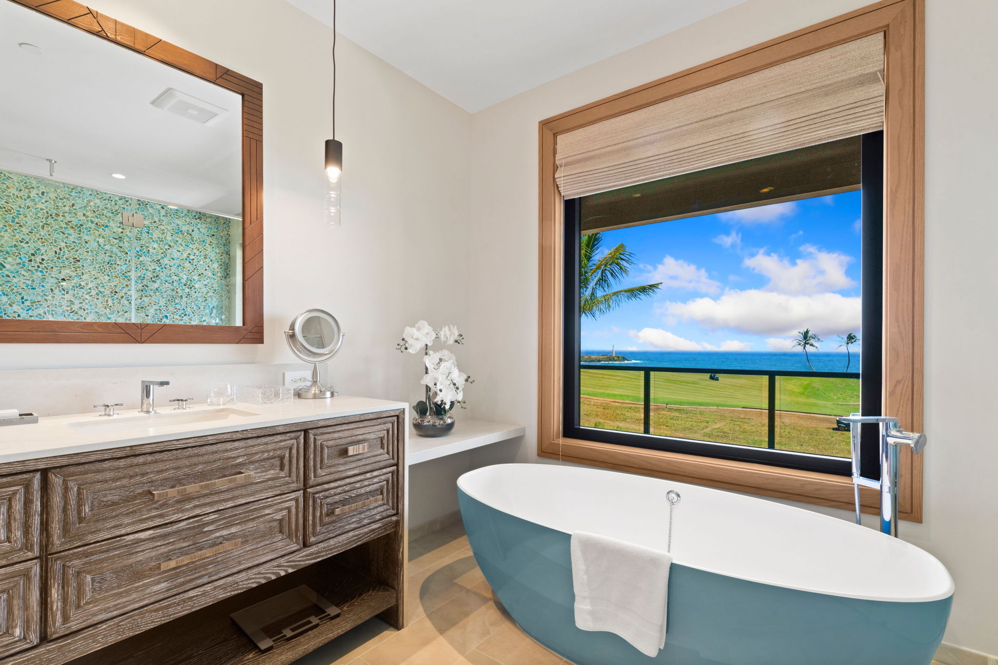 3770 Alaoli Way, Unit 3003 Lihue, HI 96766 - Photo 25 of 30 a bathroom with a tub a sink and large window