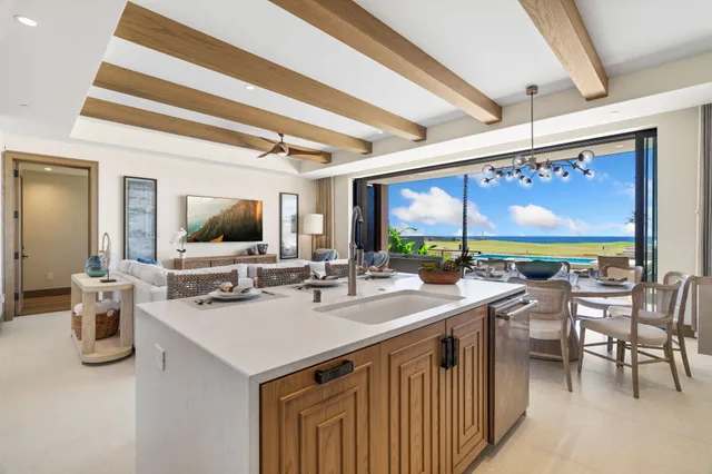 a kitchen with a sink and wooden floor