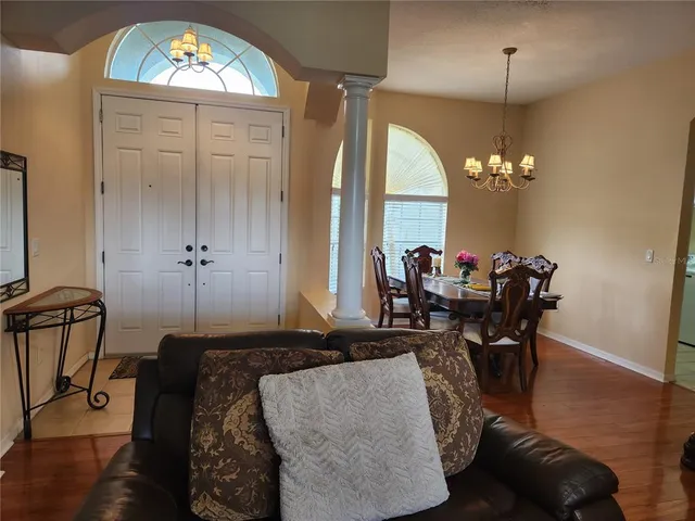 a view of a livingroom with furniture and a window