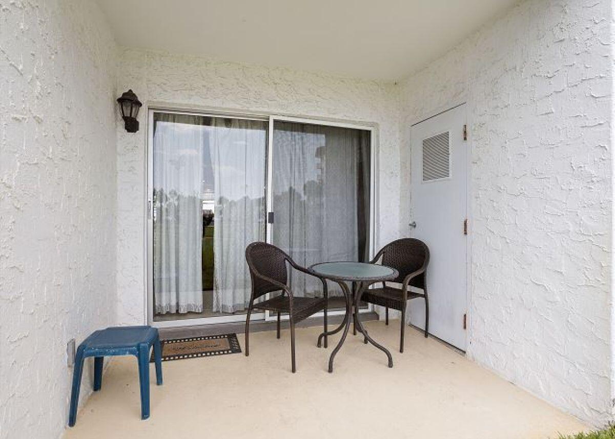 909 Santa Rosa Boulevard, Unit 211 Fort Walton Beach, FL 32548 - Photo 15 of 21 a view of a workspace with furniture and a chair