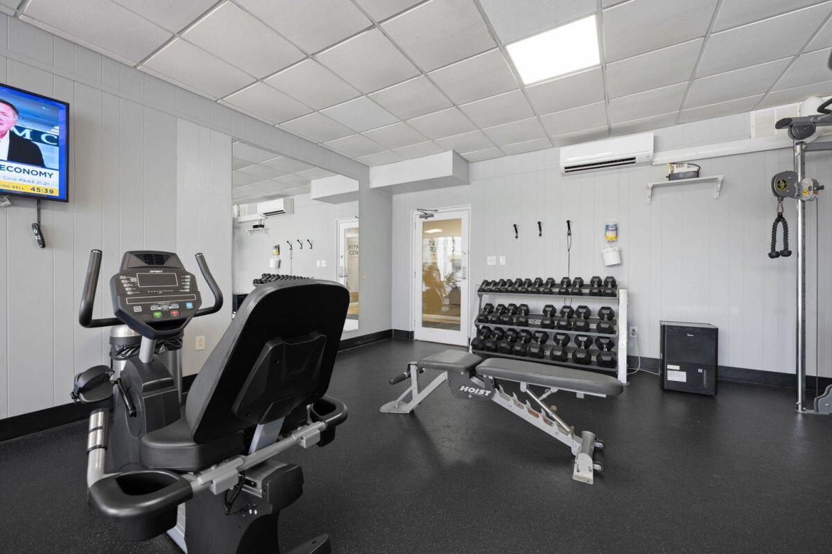 909 Santa Rosa Boulevard, Unit 211 Fort Walton Beach, FL 32548 - Photo 20 of 21 a view of a room with gym equipment