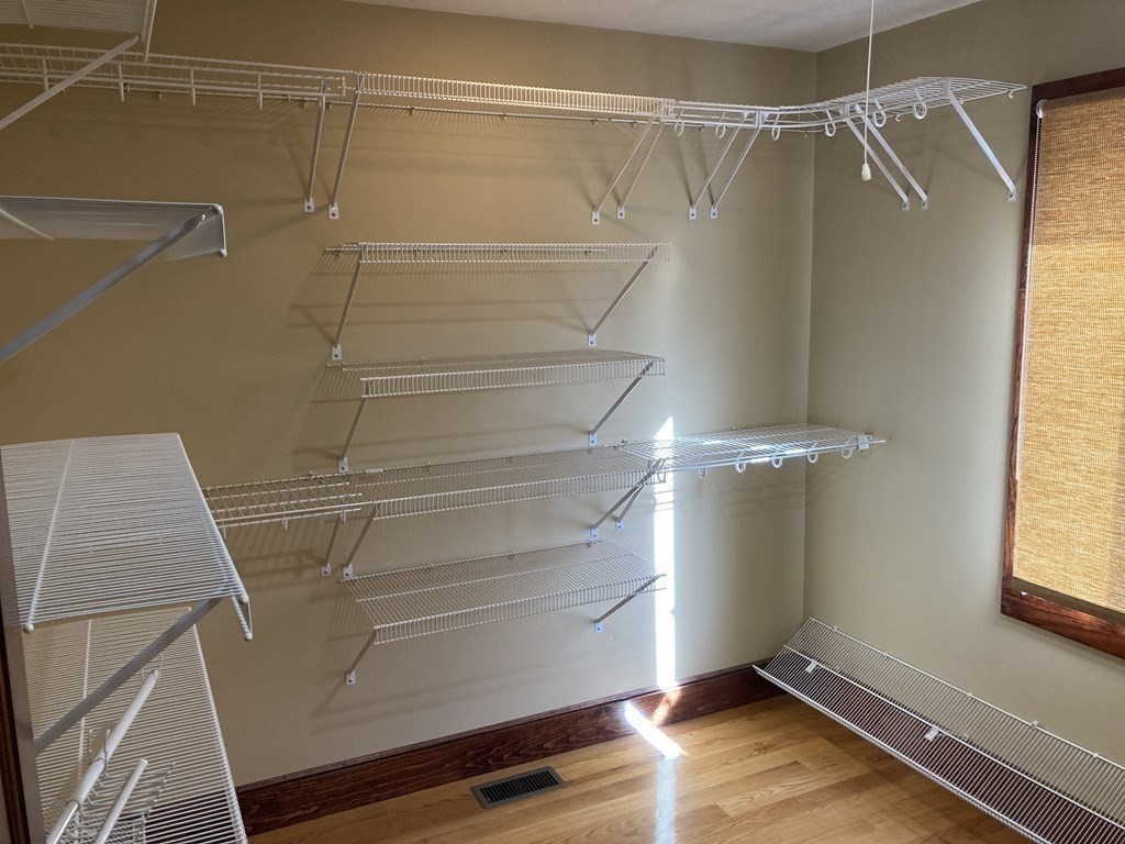 65 Purgatory Road Sutton, MA 01590 - Photo 22 of 40 a view of walk in closet with wooden floor