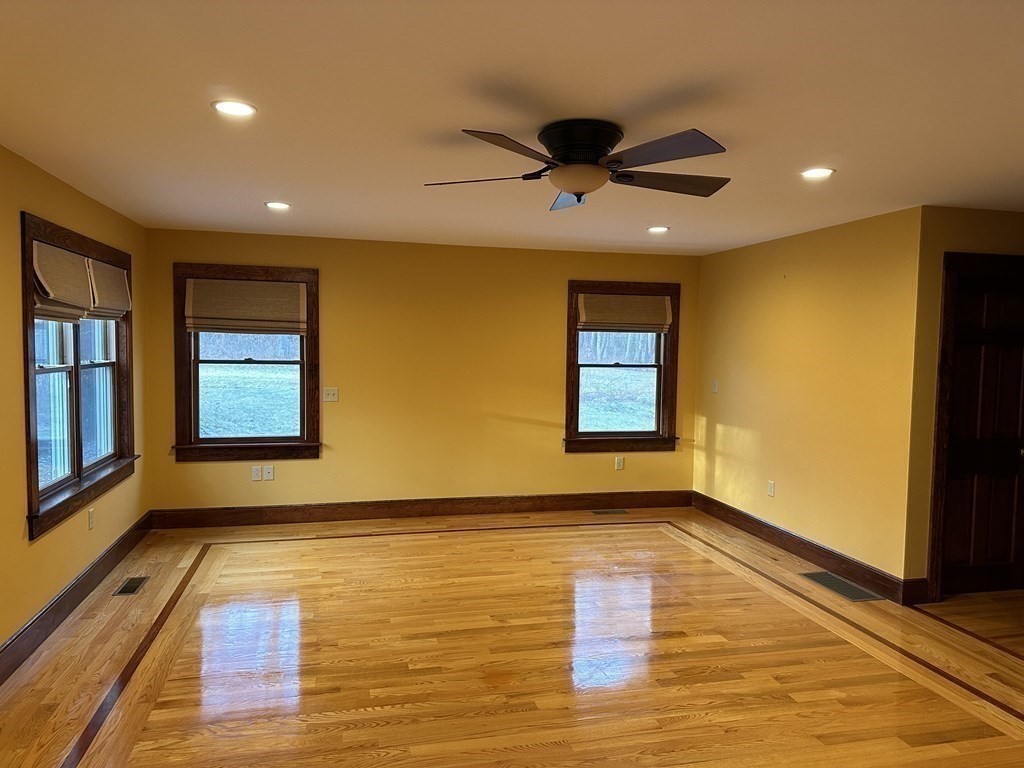 65 Purgatory Road Sutton, MA 01590 - Photo 23 of 40 a view of hallway with window and wooden floor