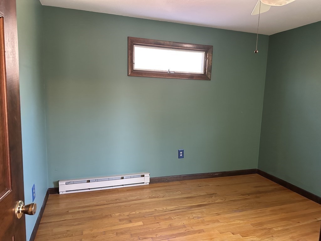 65 Purgatory Road Sutton, MA 01590 - Photo 27 of 40 a view of a room with wooden floor and fan