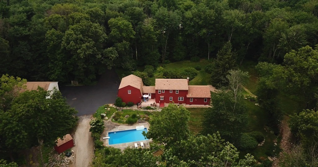 65 Purgatory Road Sutton, MA 01590 - Photo 3 of 40 an aerial view of a house with outdoor space and trees all around