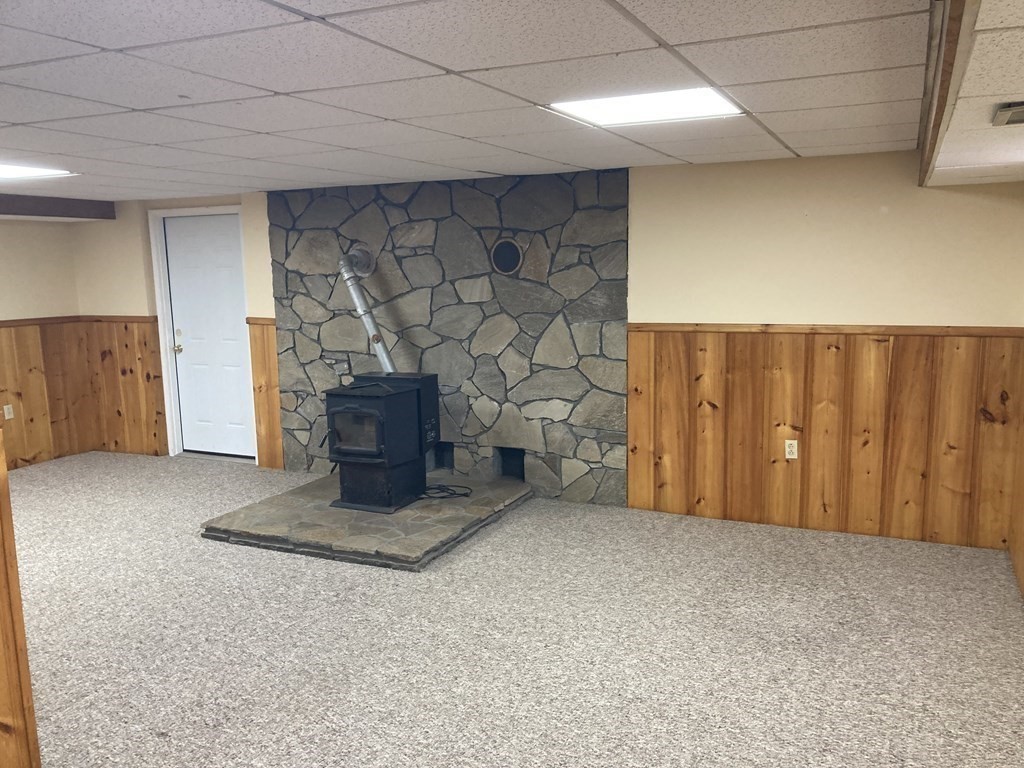 65 Purgatory Road Sutton, MA 01590 - Photo 33 of 40 a view of an empty room with a fireplace