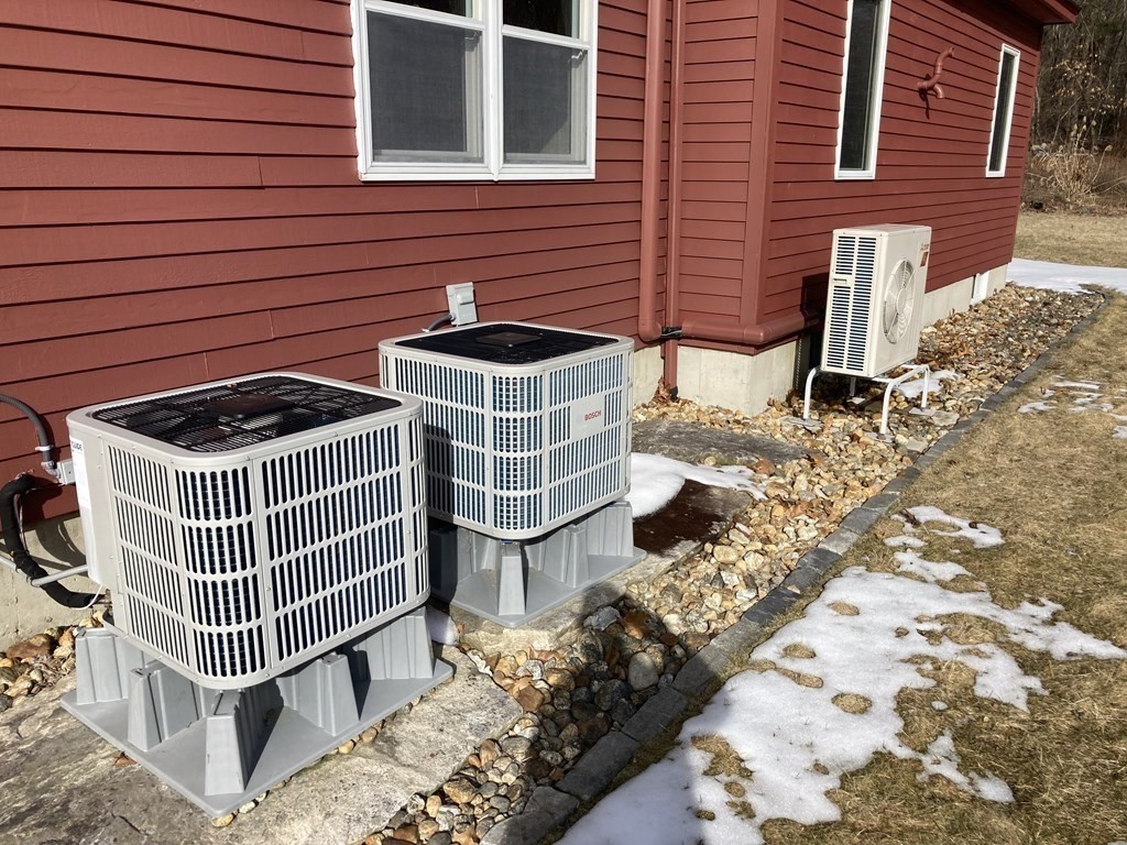 65 Purgatory Road Sutton, MA 01590 - Photo 39 of 40 a front view of a house with iron fence