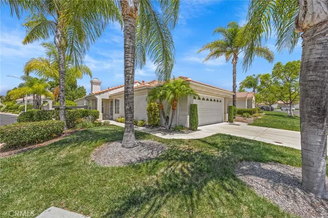 a house with palm tree in front of it