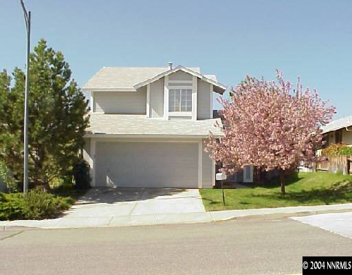 1433 Ambassador Drive Reno, NV 89523 - Photo 1 of 1 a view of a white house with a yard and large tree