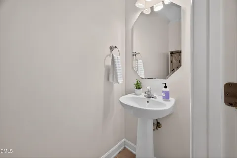 a view of empty room with a fireplace and fan