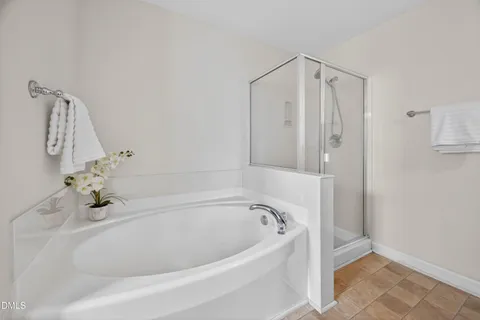 a bathroom with a sink a light fixture and a mirror