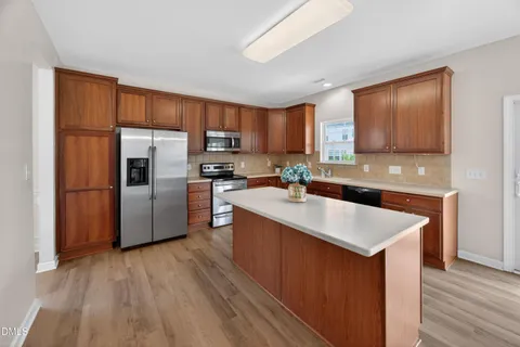 a view of an entryway with wooden floor and a window