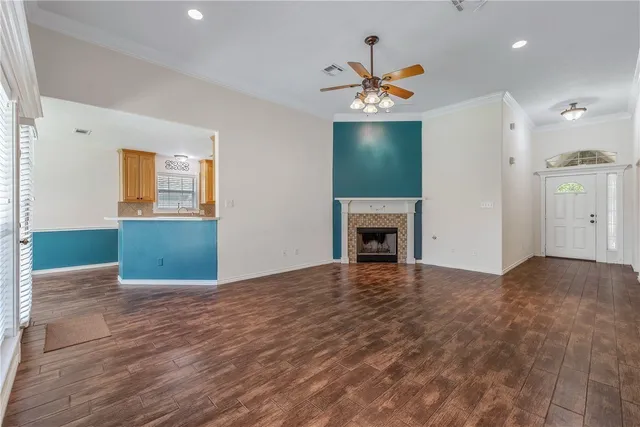 a view of empty room with window and fireplace