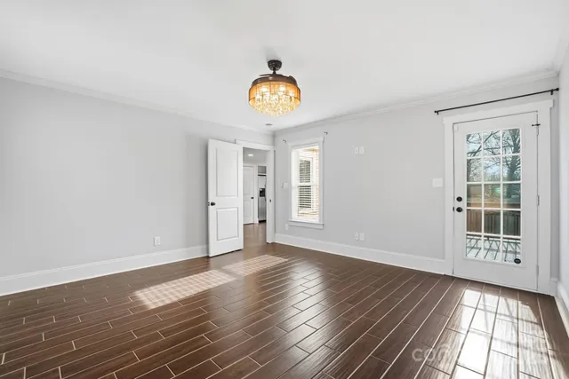 a view of an entryway with wooden floor