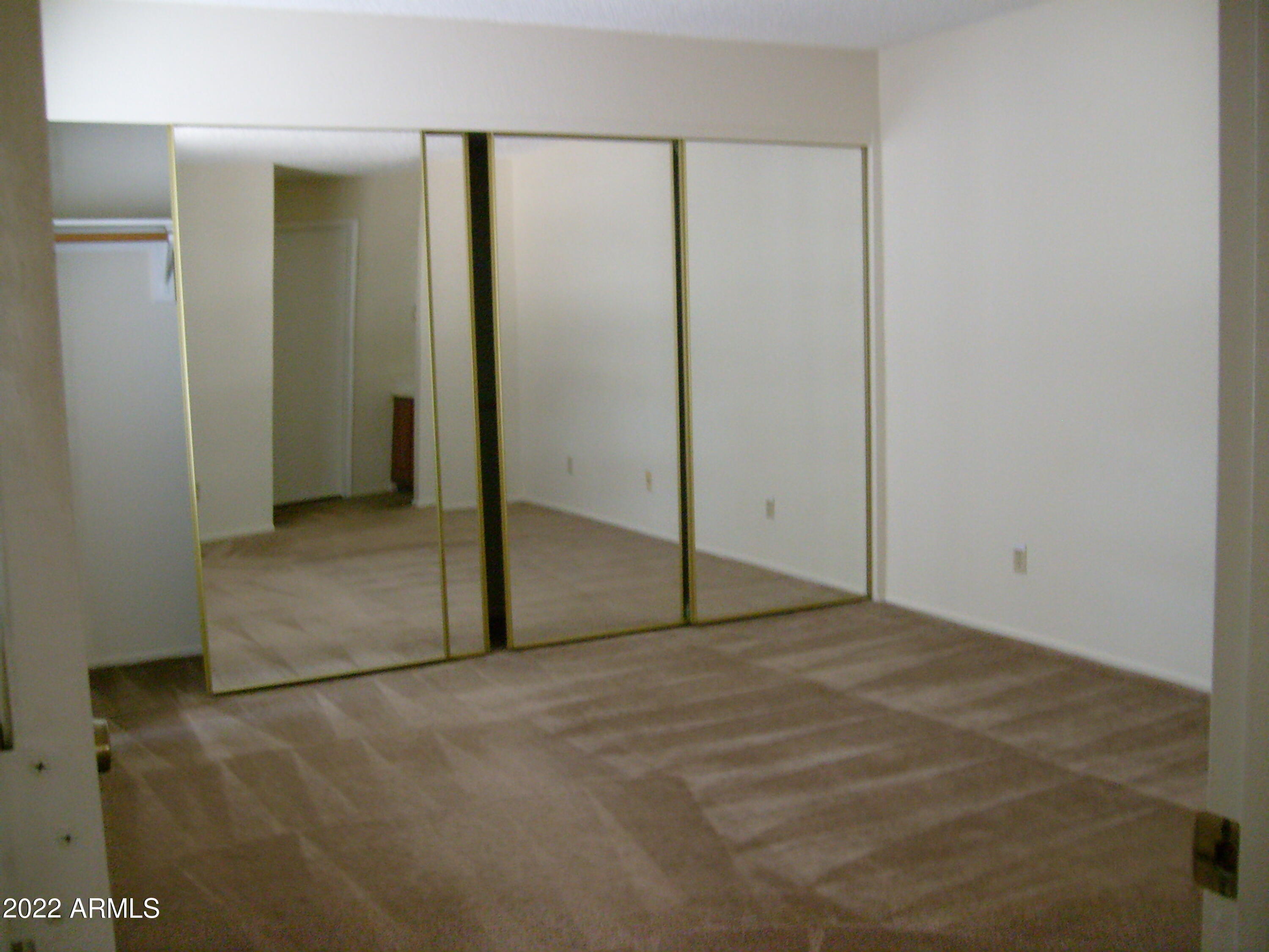 5236 West Peoria Avenue, Unit 115 Glendale, AZ 85302 - Photo 19 of 19 an empty room with closet