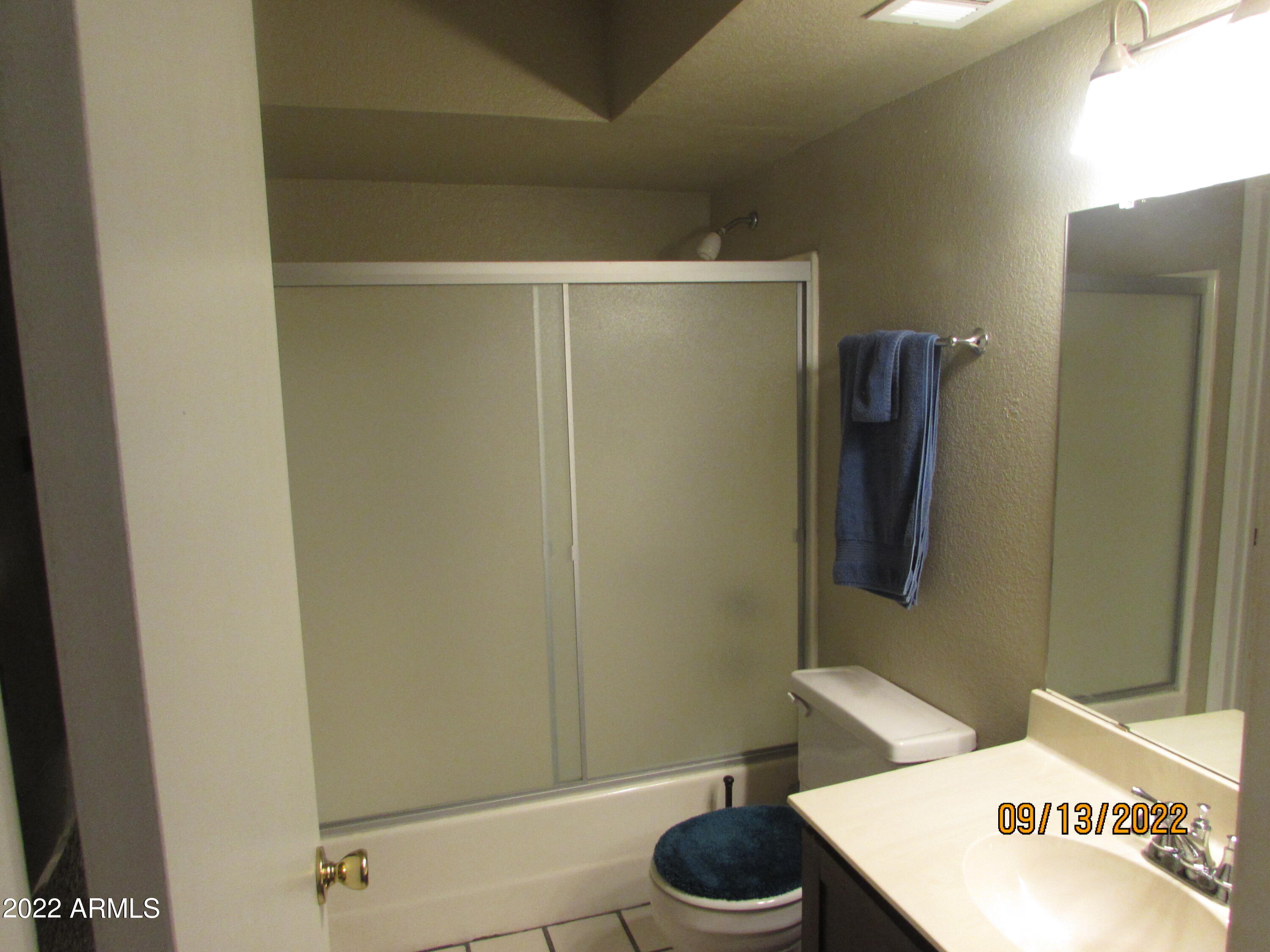 5236 West Peoria Avenue, Unit 115 Glendale, AZ 85302 - Photo 7 of 19 a bathroom with a shower and a toilet