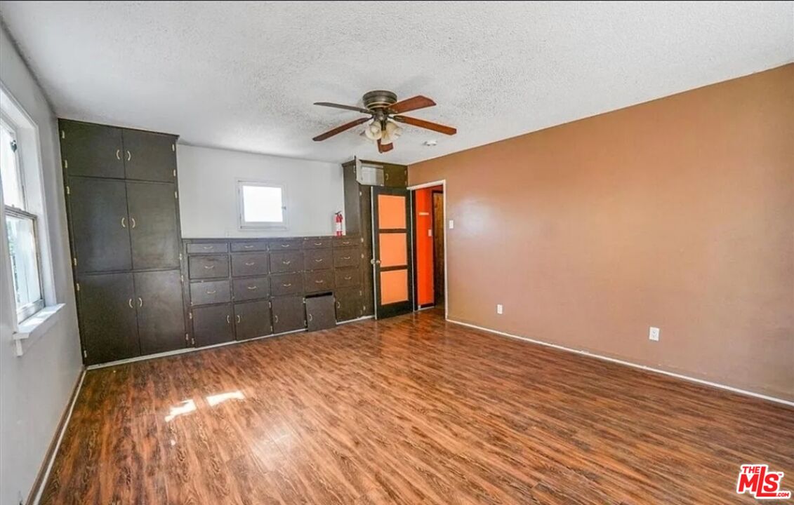 2010 East 122nd Street Compton, CA 90222 - Photo 15 of 28 a view of empty room with wooden floor and fan