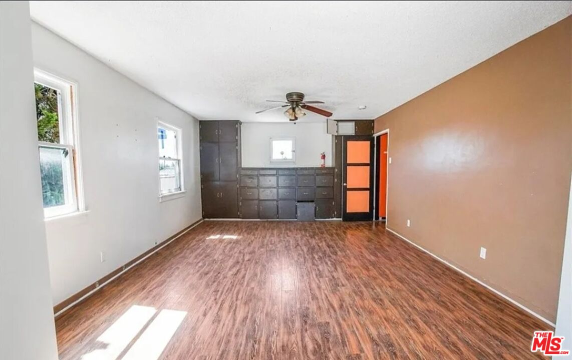 2010 East 122nd Street Compton, CA 90222 - Photo 18 of 28 a view of empty room with wooden floor and fan