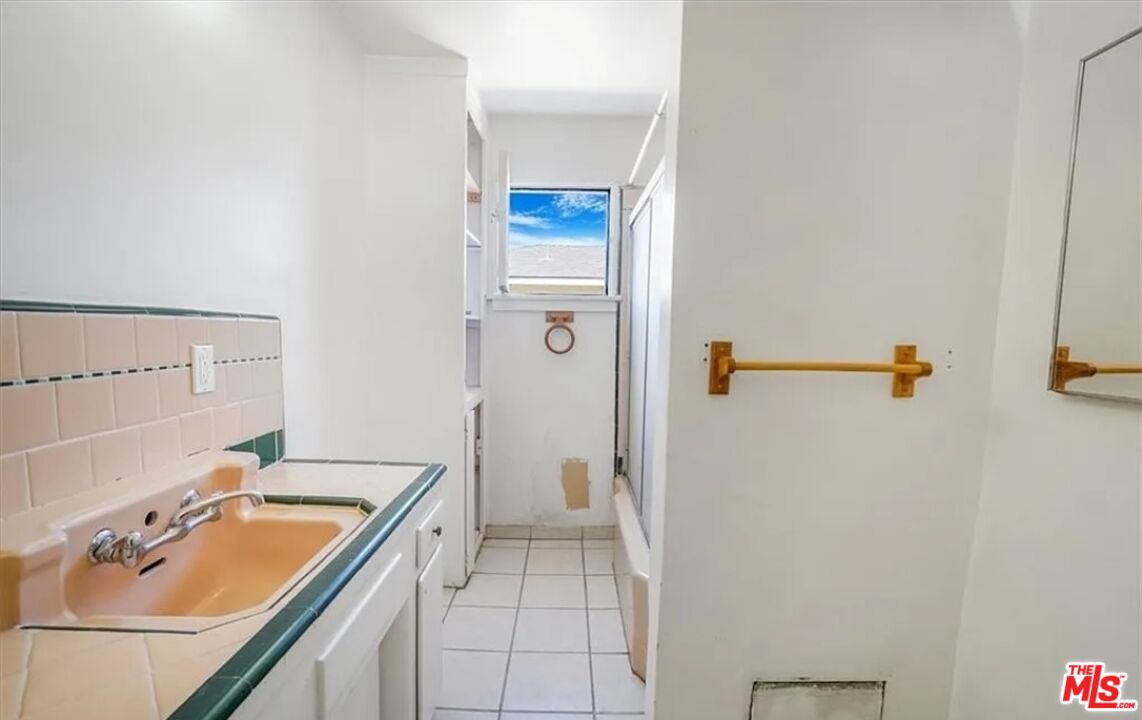 2010 East 122nd Street Compton, CA 90222 - Photo 21 of 28 a bathroom with a sink a toilet and shower