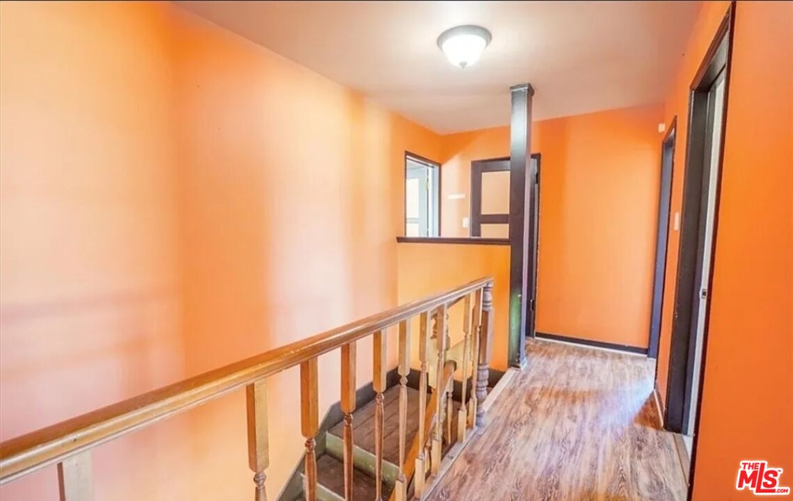 2010 East 122nd Street Compton, CA 90222 - Photo 24 of 28 a view of a hallway with wooden floor