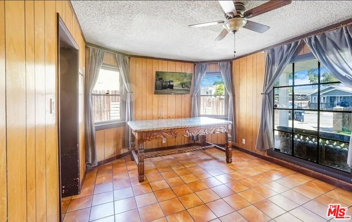 2010 East 122nd Street Compton, CA 90222 - Photo 9 of 28 a living room with a large window and table
