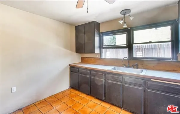 a bathroom with a sink and a large mirror