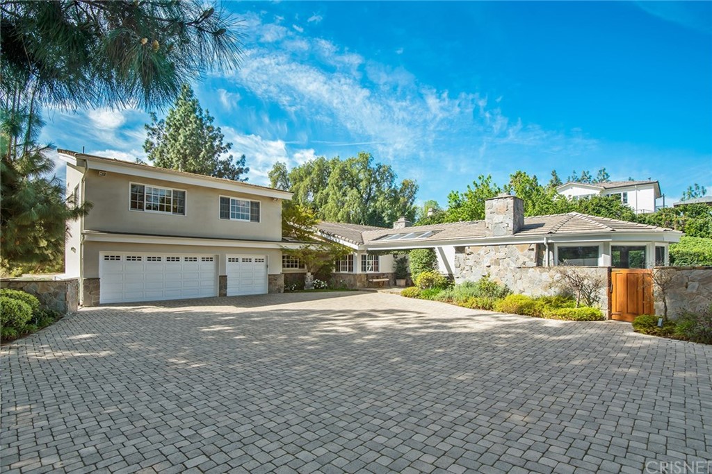24907 Kit Carson Road Hidden Hills, CA 91302 - Photo 1 of 1 front view of a house with a yard
