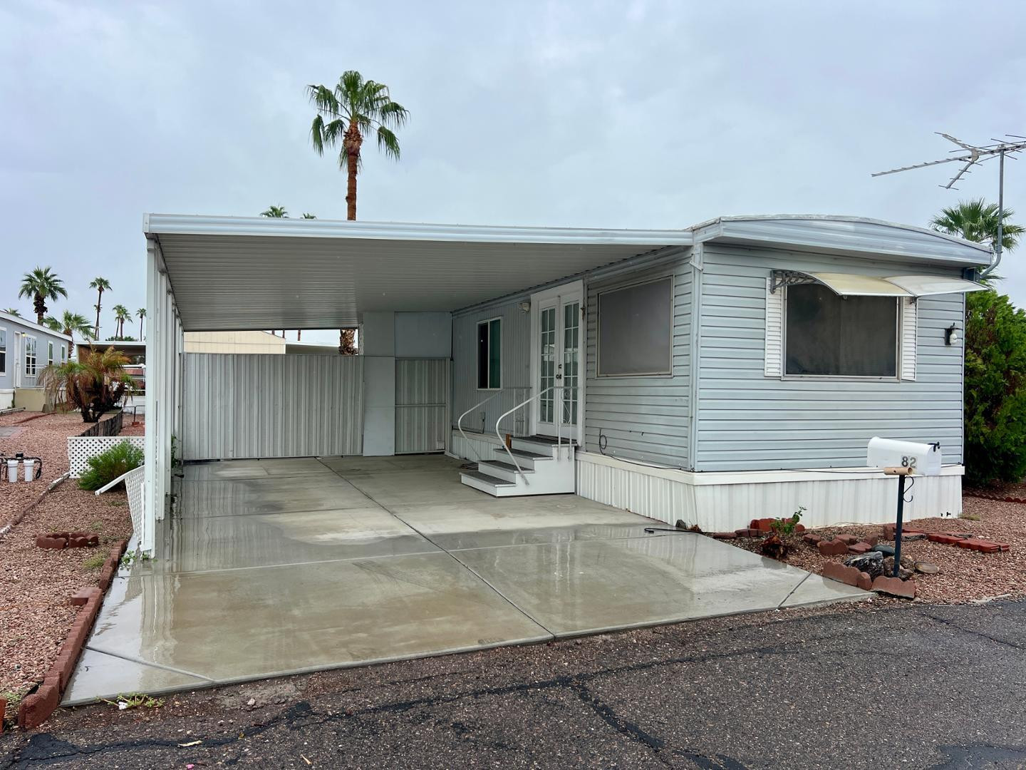 345 South 58th Street, Unit 82 Mesa, AZ 85206 - Photo 1 of 17 a view of a house with a patio and a yard