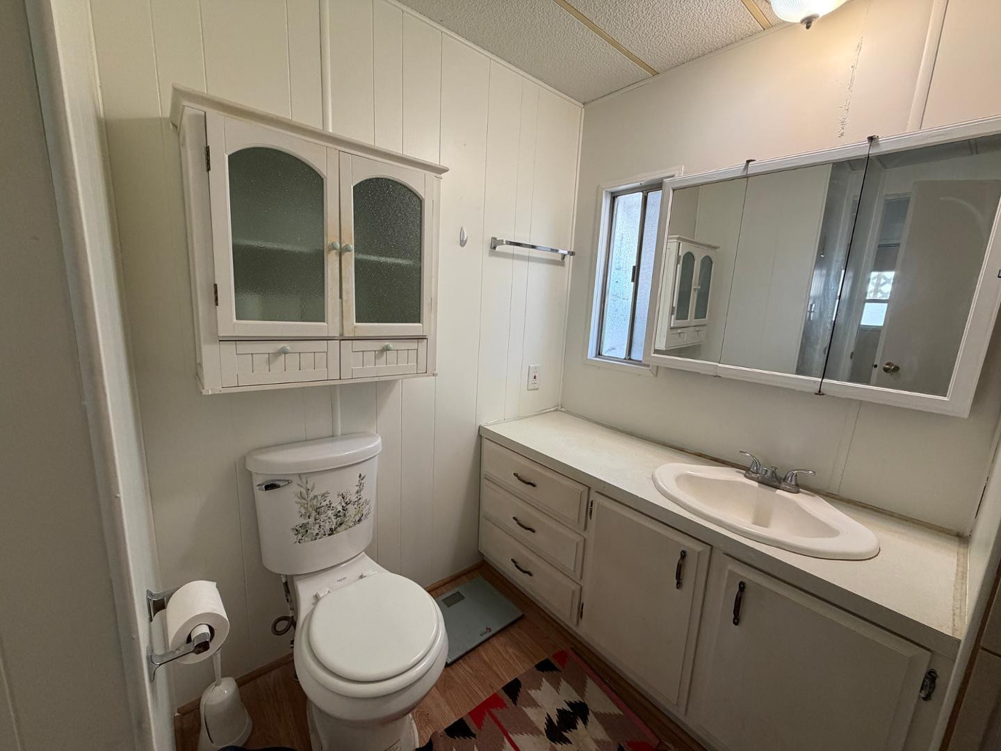 345 South 58th Street, Unit 82 Mesa, AZ 85206 - Photo 2 of 17 a bathroom with a toilet sink and mirror