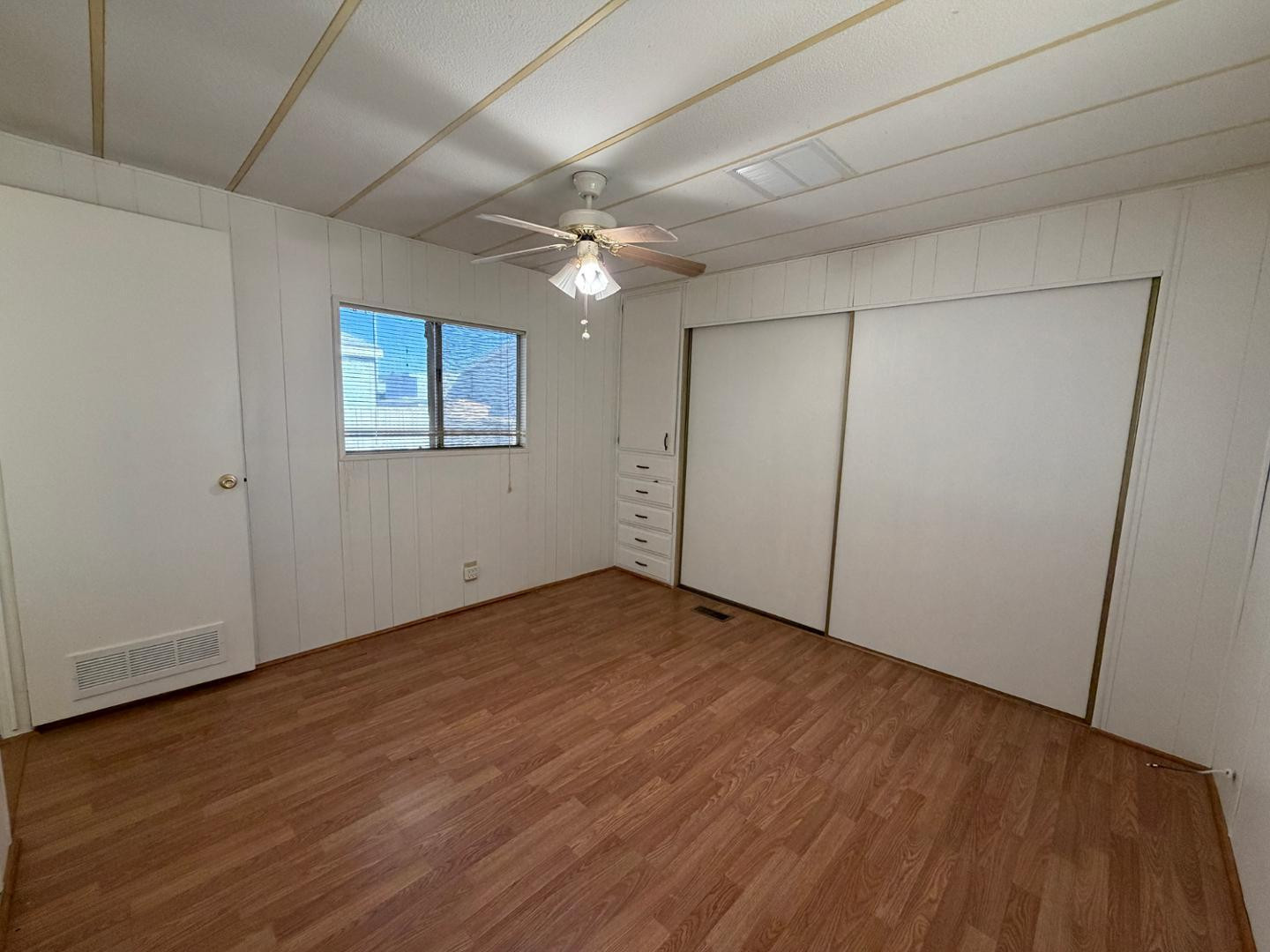 345 South 58th Street, Unit 82 Mesa, AZ 85206 - Photo 5 of 17 a view of an empty room with wooden floor
