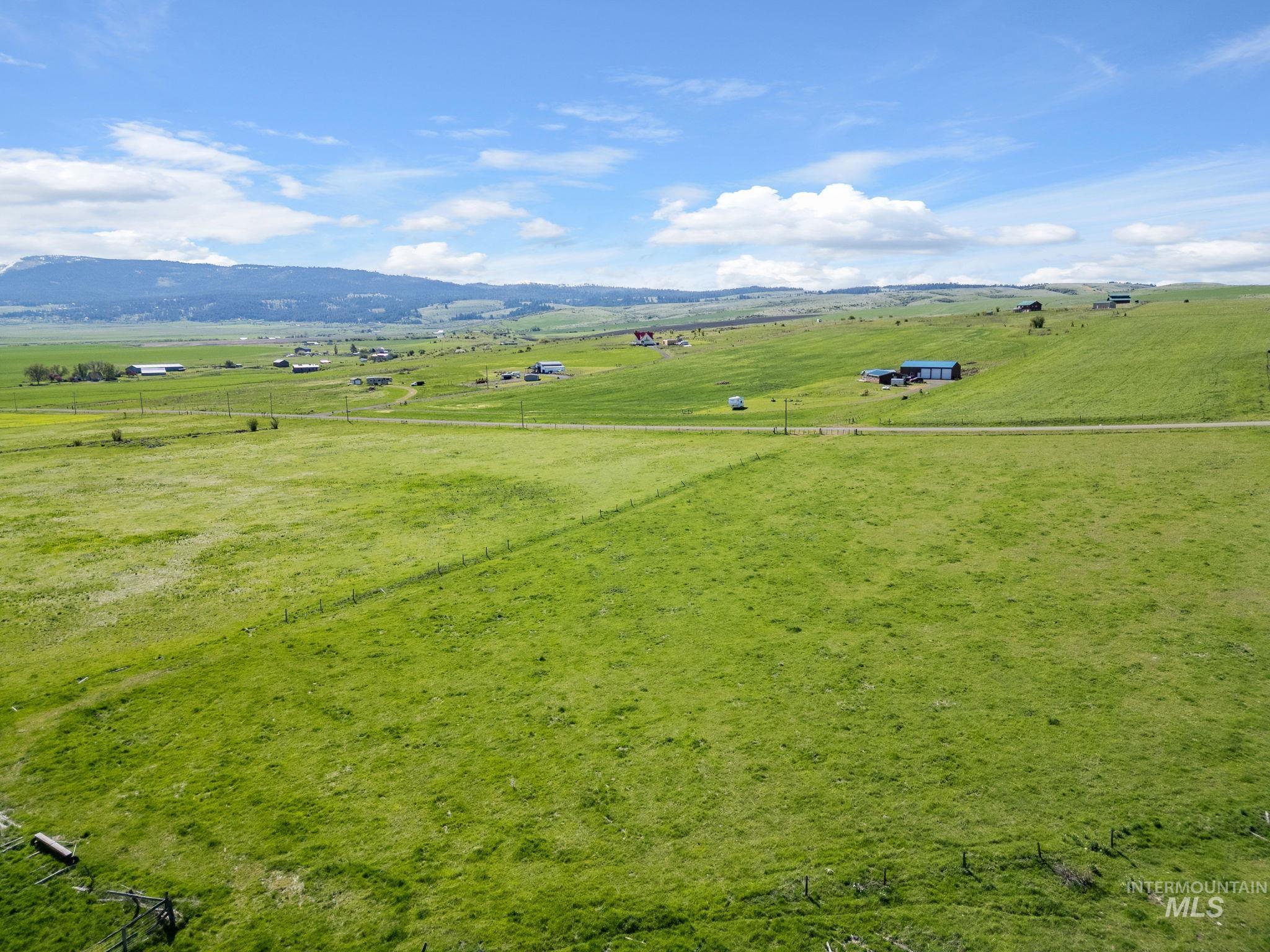 Lot 5 Gill Point Road Grangeville, ID 83530 - Photo 2 of 20 Aerial view of sparsely populated area featuring agricultural land and a mountain backdrop