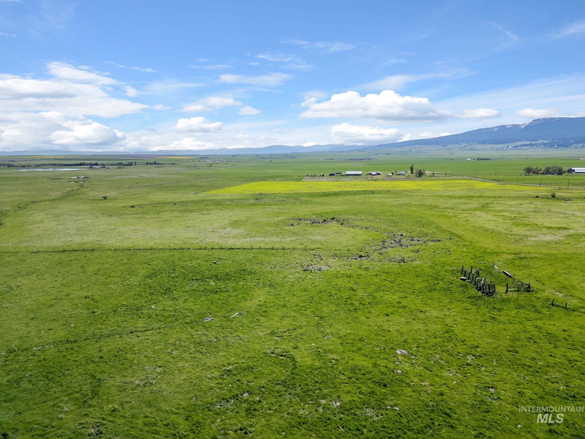 Lot 5 Gill Point Road Grangeville, ID 83530 - Photo 5 of 20 Aerial view of sparsely populated area featuring a pastoral area and a mountainous background