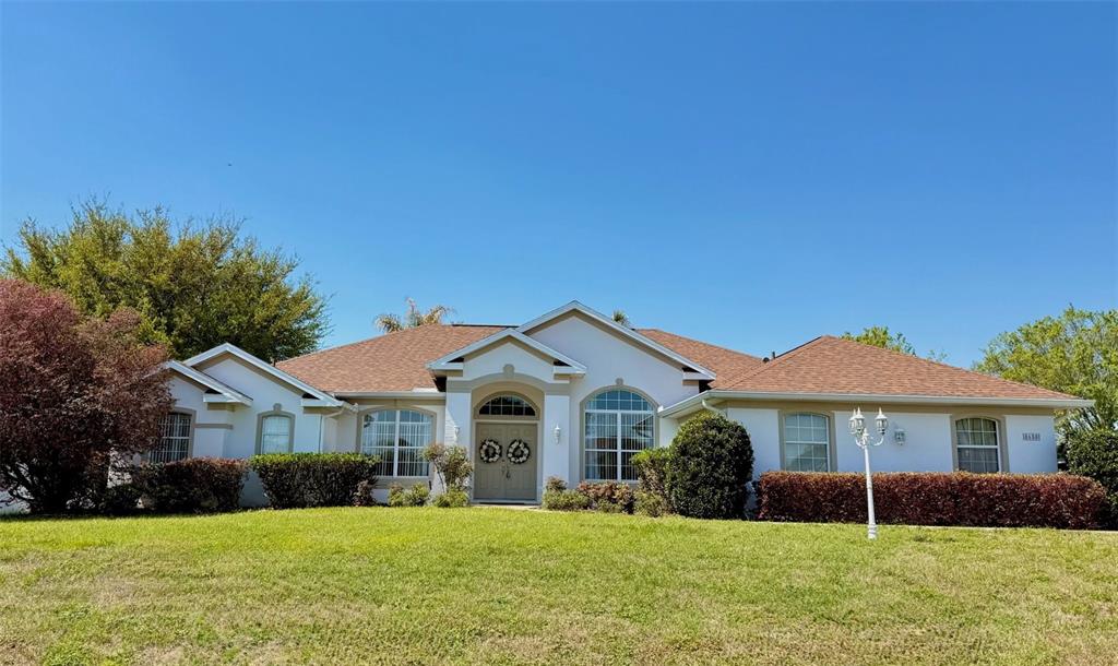 8650 Southwest 55th Court Ocala, FL 34476 - Photo 1 of 1 a front view of a house with a yard