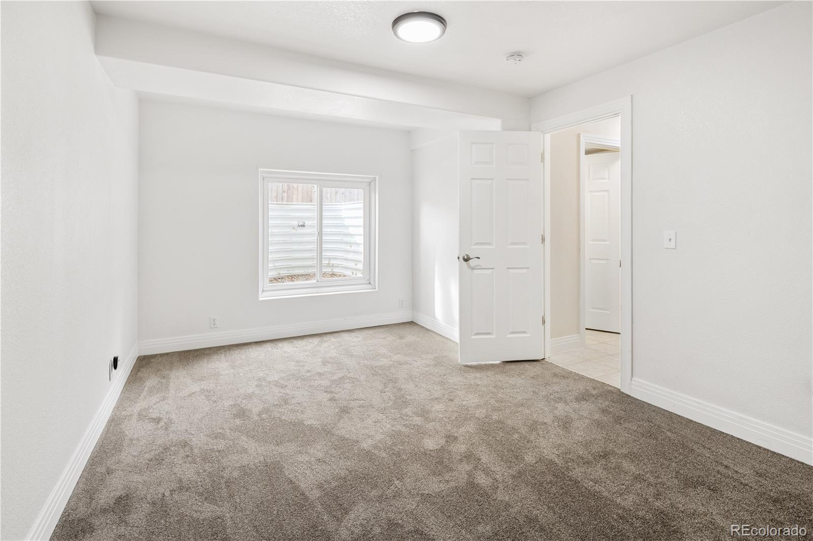 380 County Road Louisville, CO 80027 - Photo 31 of 42 an empty room with windows and closet