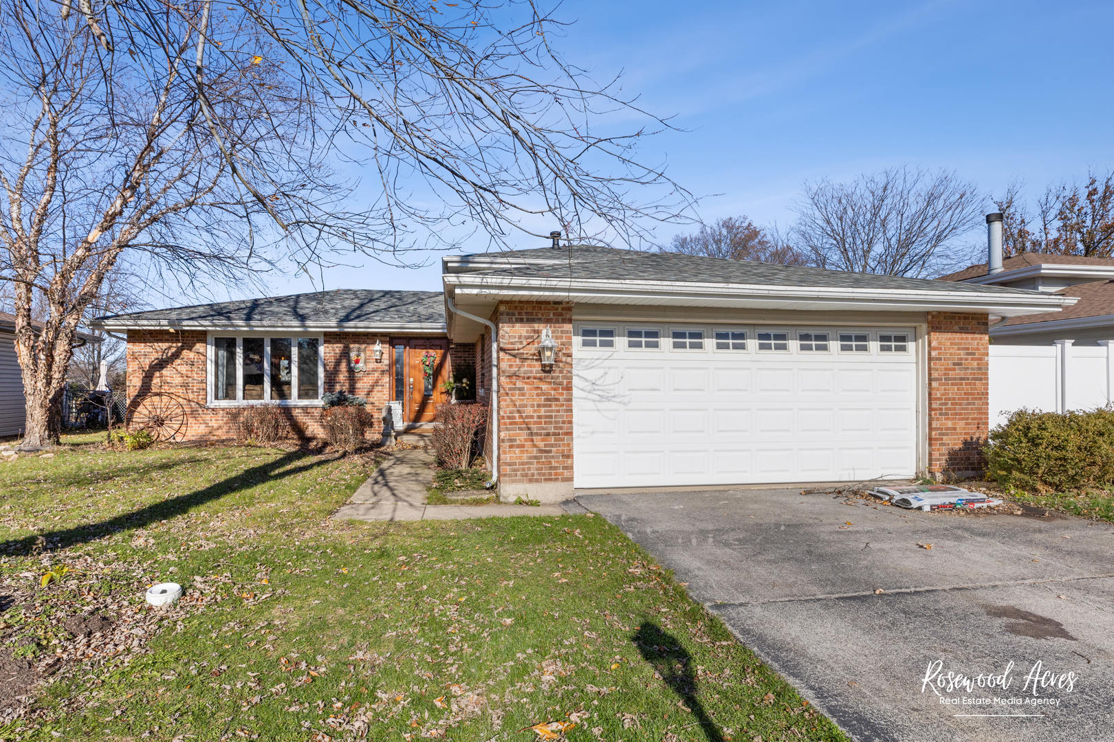 a view of a house with a yard and a garage