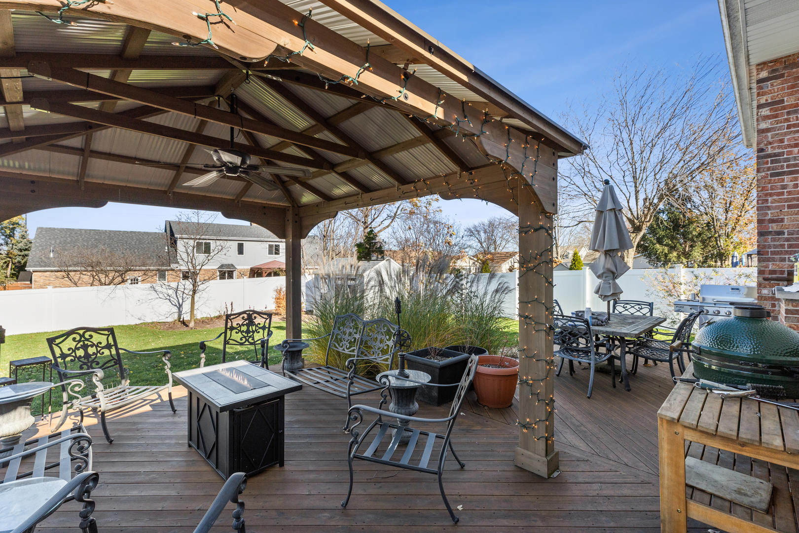 11016 Kimberly Trail Mokena, IL 60448 - Photo 21 of 22 a patio with wooden floor a yard a table and chairs
