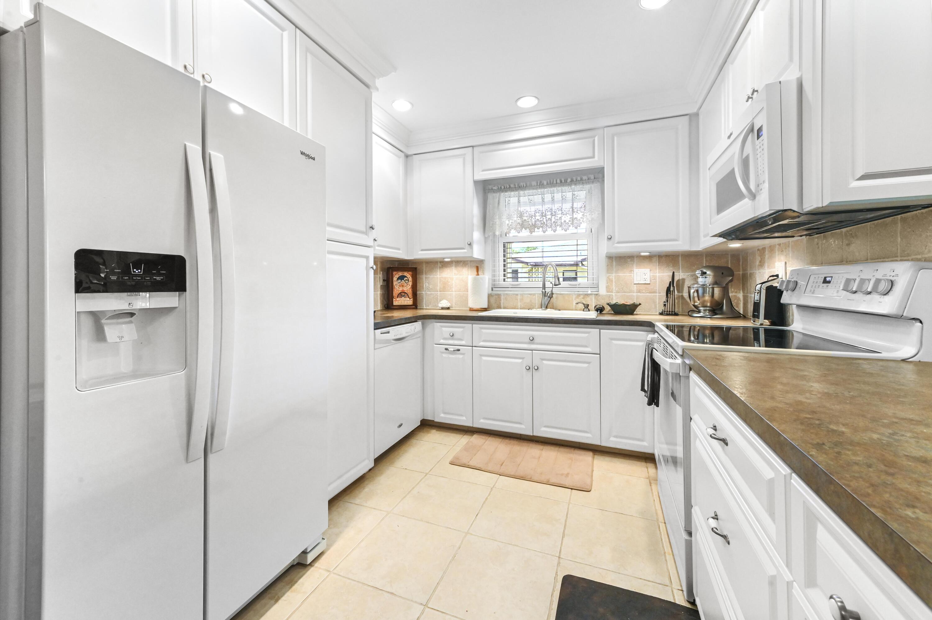 14080 Nesting Way, Unit A Delray Beach, FL 33484 - Photo 7 of 30 10 Kitchen 01