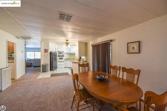 a living room with furniture gym equipment and a window